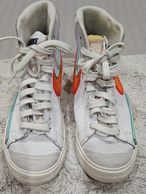 Nike White High-Top Sneakers with Red-Orange and Teal Swoosh